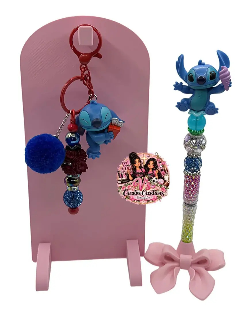 Matching blue character pen and keychain set with sparkling beads and a blue pom-pom.