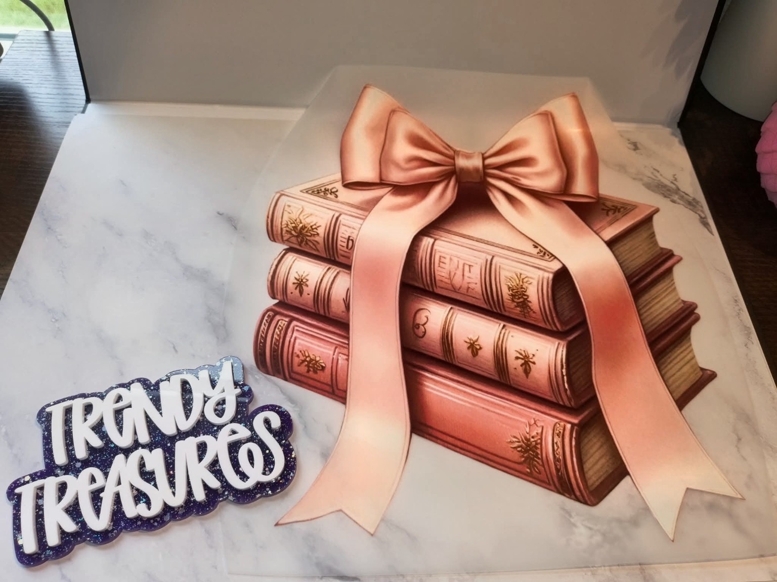 Blush Bow Book Stack design reference, not a finished garment